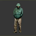 A Man Standing In Green Hooded Jacket Khaki Pants With Hands In Pockets Gray Background