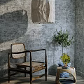 Rattan Leisure Chair with Wooden Armrests by Gray Wall Small Table Olive Tree Blue Cushion
