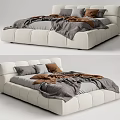 Modern Double Bed With White Leather Headboard And Gray Brown Bedding