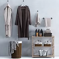 Stylish Bathroom Accessories Including Hanging Robes Towels Toiletries And Storage Baskets