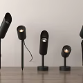Modern Black Downlights and Spotlights with Various Stylish Designs on Wooden Surface