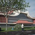 Modern Architectural Building With Red Curved Roof Green Trees Lawn And People