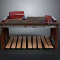 Red Toolbox Hammer And Red Device On Dark Worn Workbench With Wooden Slat Shelf