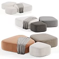 Stylish Fabric Ottomans In Various Colors With Soft Gray Throws For Living Room