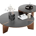 Round Black Wooden Coffee Table with Stacked Design Vase Open Magazine and White Cup