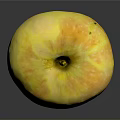 Fresh Yellow Apple With White Speckles And Stem On Shiny Black Surface