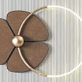 Flower Shaped And Circular Design Wall Decor With Gold Accents On Striped Wall