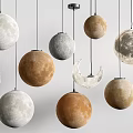 Moon Inspired Pendant Lights With Crescent And Planetary Shaped Design And Textured Surfaces 3d model