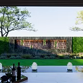 Modern Garden Landscape Design With Lush Hedge Stone Wall Lighting Trees And Water Reflection