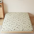 Comfortable Mattress With Diamond Quilted Leaf Print On Wooden Floor And Cabinet