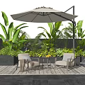 Cozy Outdoor Patio Table And Chairs Set With Umbrella And Lush Green Plants