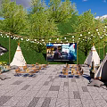 Modern Outdoor Event Plaza Space With Curved Building Tents Steps Trees And String Lights
