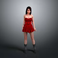 Woman in red strapless belted dress wearing gray boots against gray background