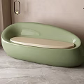 Light Green Irregular Shaped Sofa With Beige Cushion And Potted Plant On Gray Marble Floor