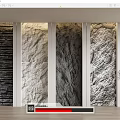 Four Textured Stone Wall Panels With White Frames Light Wood Floor And Potted Plant