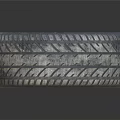 High Performance Car Tire With Black Alloy Wheel Rim Red Brake Caliper And Deep Tread Pattern