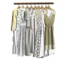 Light Colored Fashionable Clothes Hanging On Wooden Hangers With Striped And Dotted Patterns