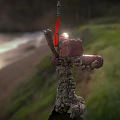 Mech Robot With Glowing Core Red Flag And Rocky Legs Stands By Coastal Bridge