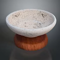 Elegant Carved Bowl Shaped Marble Sculpture with Textured Surface and Wooden Base