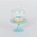 Colorful Decorated Yellow Donut With White Cartoon Figure Under Glass Dome On Blue Pedestal Tray