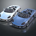Two Silver And Blue Convertible Sports Cars With Sleek Design And Glossy Finish