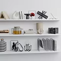 Inflatable Decorative Models Display On White Shelf With Geometric Ornaments And Books