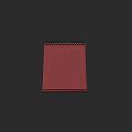 Decorative Ornament Set With Red Spiral Notebook On Dark Background