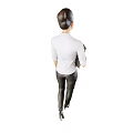 Confident woman walking in casual shirt and black leather pants holding folder