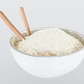 White Bowl Filled With Cooked Rice And Wooden Chopsticks Inside