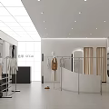 Modern Clothing Store With White Interior Mannequins Racks And Bright Lighting