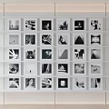 Black and White Photos Arranged on White Display Shelf Gallery Wall