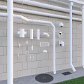 White Pipes with Fittings Elbows Tees Caps on Gray Brick Wall with Drain and Lawn