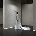 Elegant Bridal Wedding Dress Shop With White Gown Mannequin And Floral Wall Decor
