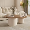 Beige Sofa With Two Round Coffee Tables Wooden Tabletop White Cylindrical Base And Magazines