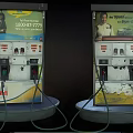 Public Fuel Station Facility With Old Fuel Pumps And Advertisement Billboards
