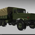 Green Military Utility Vehicle With Canvas Covered Cargo Bed And Large Off Road Tires