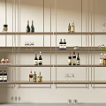 Modern Wine Cabinet With Open Metallic Shelves Holding Wine Bottles And Glasses