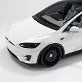 White Tesla Model X Electric SUV With Black Wheels And Modern Exterior Design