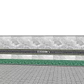 Outdoor Feature Wall With Marble Texture And Green Base Trim On Paved Ground