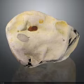 Natural Speckled Stone With Yellow Brown White Tones And Textured Surface