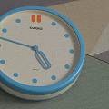 Round Wall Clock With Beige Frame Black And White Striped Dial And Colorful Hands