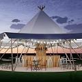 Outdoor Conical Top Tent Bar With String Lights And Wooden Tables Chairs