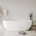 White Bathtub with Red Petals Hanging White Robe Towel Rack Side Table and Green Plant