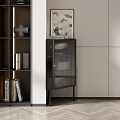 Stylish Modern Black Cabinet With Ribbed Glass Doors And Decorative Artwork Near Bookshelf