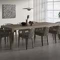 Long Wooden Outdoor Table with Woven Chairs and Decorative Items Near Window and Potted Plant
