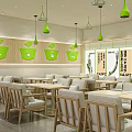 Modern Milk Tea Shop Interior With Green Decor And Wooden Tables Chairs