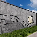 Natural Stone Feature Wall With Carved Wave Patterns And Circular Moon Design Elements 3d model