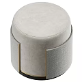 Light Gray Round Ottoman With Soft Fabric Upholstery And Gold Accents
