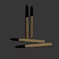 Brass Artillery Shells With Black Warheads And Red Markings On Dark Background