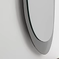 Modern Oval Mirror With Black Frame Reflecting Living Room Sofa Curtains And Lamp